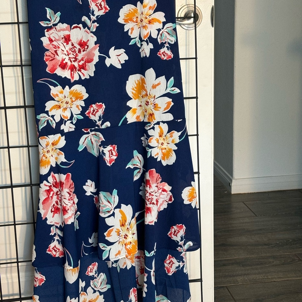Ashley Stewart Hi low flare Skirt in Navy Blue with multi color floral print.